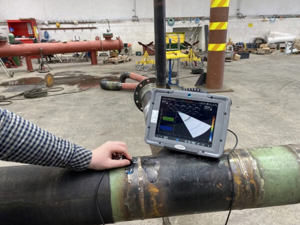 Mentor UT Phased Array Flaw Detector on pipe scaled
