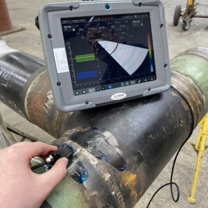 Mentor UT Phased Array Flaw Detector on pipe with custom screen scaled